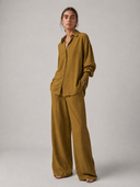 Nawa Olive relaxed button-down shirt with classic shirt collar styled with Nawa Olive wide leg tailored trousers which are made of a modal blend fabric with a smooth lightweight feel with a soft drape that moves naturally and holds its shape through the day