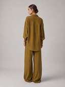 Nawa  Olive wide leg tailored trousers in wide-leg cut and full-length fluid leg made with lightweight modal fabric paired with the Nawa Olive relaxed button-down shirt with longer hem length



